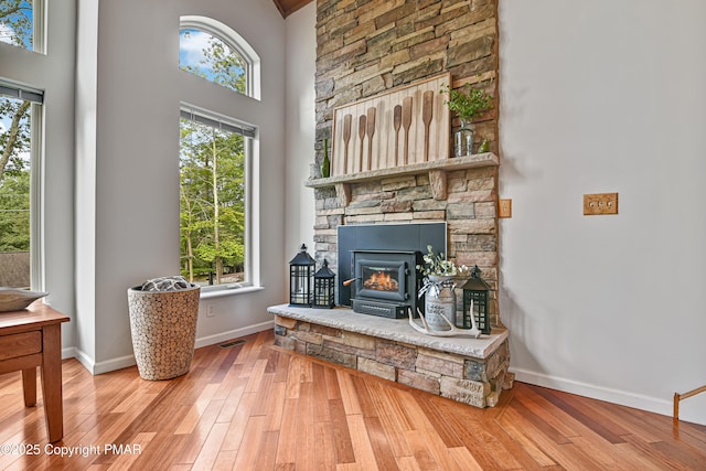 interior space featuring a healthy amount of sunlight, visible vents, and wood finished floors