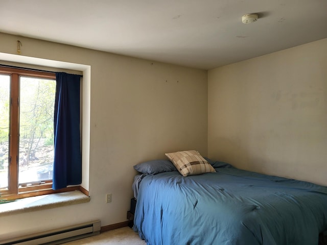 74 Split Rock Rd, Lake Harmony, PA 18624 - bedroom with a baseboard radiator, light carpet, and baseboards
