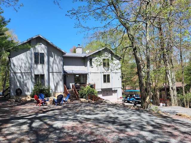 74 Split Rock Rd, Lake Harmony, PA 18624 - view of front of property featuring stairway, a chimney, and an outdoor fire pit