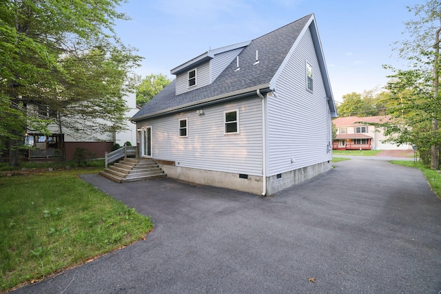 9436 Juniper Dr, Tobyhanna, PA 18466 - view of home's exterior featuring crawl space and roof with shingles