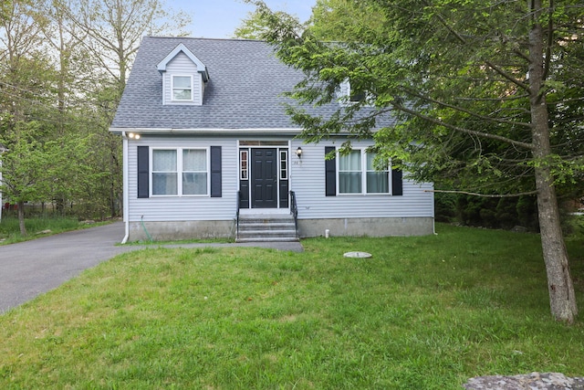 9436 Juniper Dr, Tobyhanna, PA 18466 - new england style home with a front yard and a shingled roof