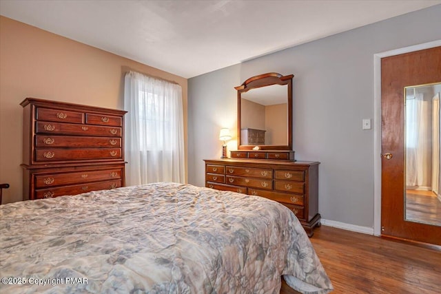 bedroom featuring dark hardwood / wood-style floors