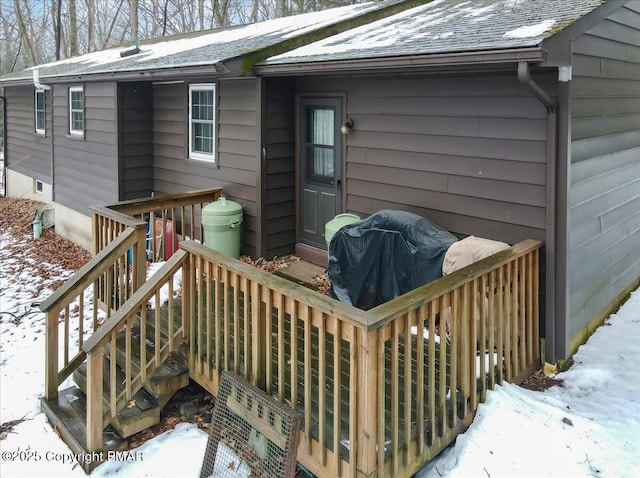 view of snow covered deck