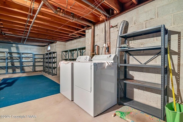 clothes washing area featuring washer and dryer