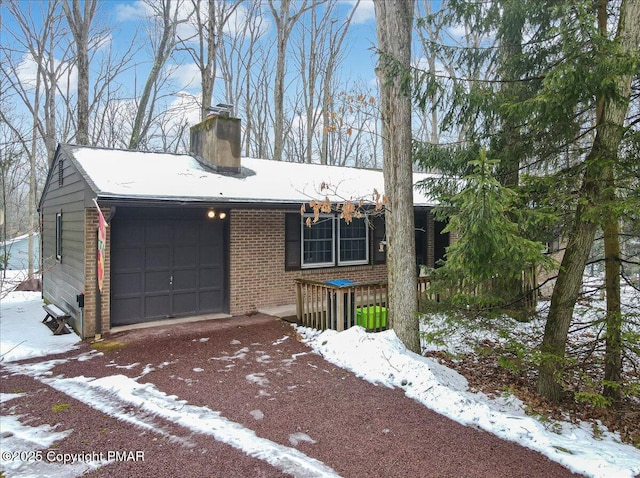 single story home featuring a garage