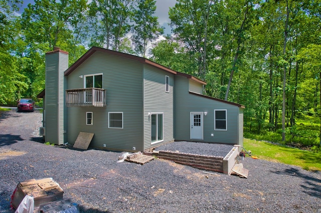 371 Underhill Dr, Tamiment, PA 18371 - back of house with a chimney and a balcony