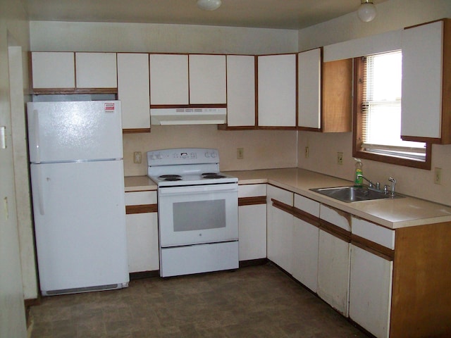 1166 Hunters Woods Dr, East Stroudsburg, PA 18301 - kitchen with white appliances, white cabinets, under cabinet range hood, a sink, and light countertops