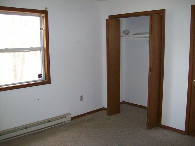 1166 Hunters Woods Dr, East Stroudsburg, PA 18301 - unfurnished room with baseboards, light carpet, and baseboard heating