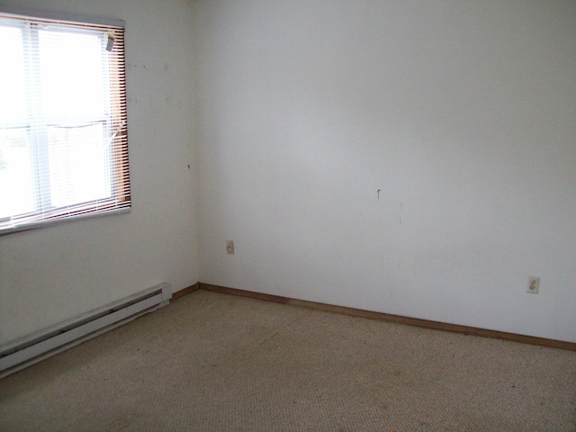 1166 Hunters Woods Dr, East Stroudsburg, PA 18301 - unfurnished room featuring a wealth of natural light, baseboards, a baseboard radiator, and light colored carpet