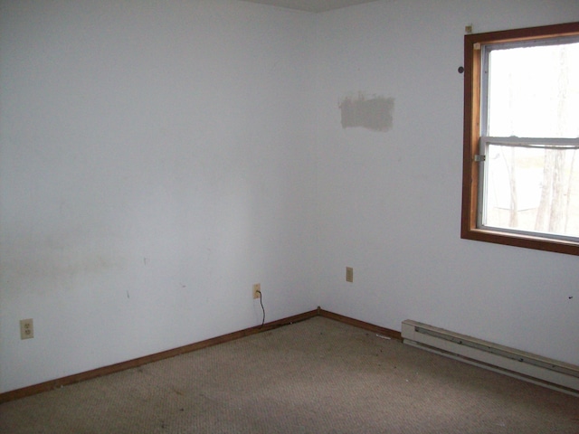 1166 Hunters Woods Dr, East Stroudsburg, PA 18301 - empty room featuring light carpet, plenty of natural light, a baseboard radiator, and baseboards