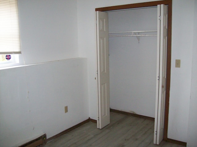 1166 Hunters Woods Dr, East Stroudsburg, PA 18301 - unfurnished bedroom with a closet and light wood-style flooring