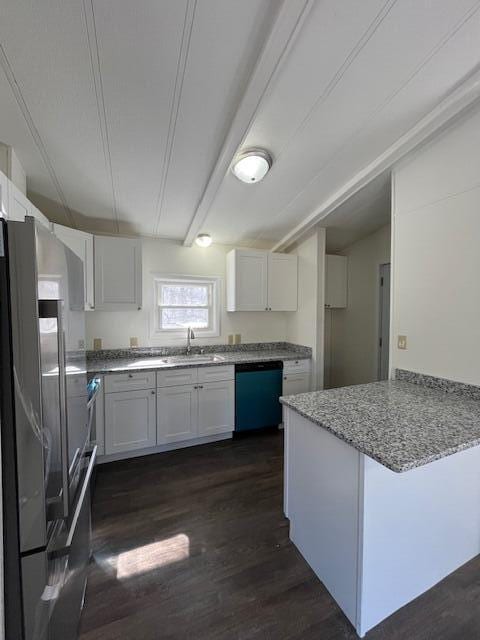 kitchen featuring light stone countertops, dishwasher, a peninsula, white cabinetry, and a sink