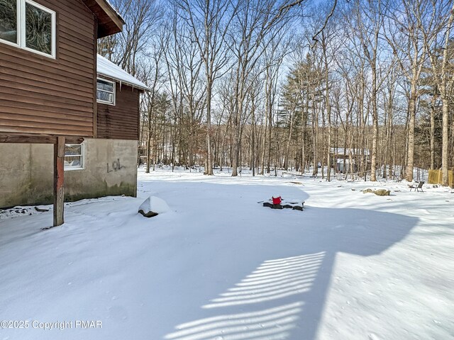 view of yard covered in snow