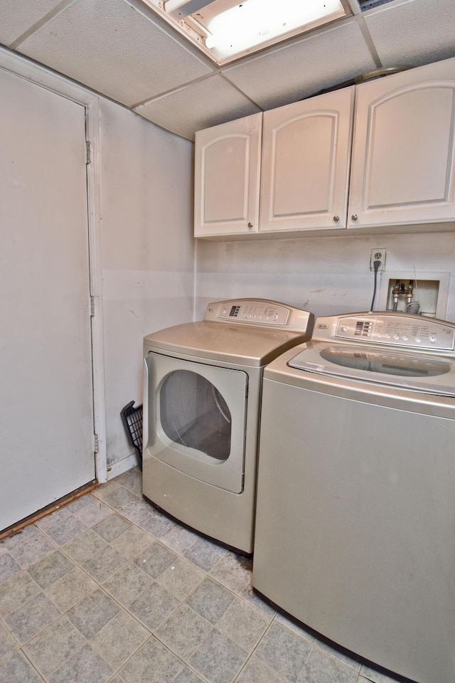 washroom featuring cabinet space and washer and dryer