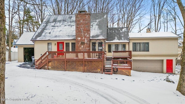 view of front of home with a chimney and a deck