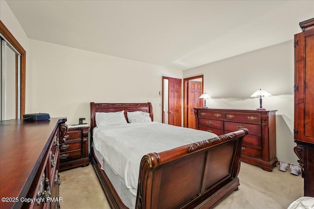 bedroom with light colored carpet