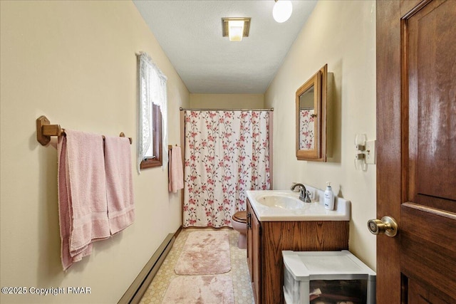 full bath with a textured ceiling, toilet, a baseboard heating unit, vanity, and a shower with curtain