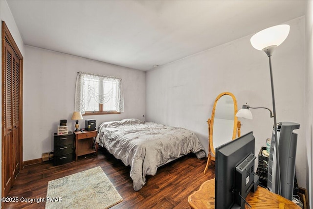 bedroom with a closet and wood finished floors