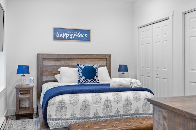 22 Petrarch Trl, Albrightsville, PA 18210 - bedroom with a closet, baseboard heating, baseboards, and wood finished floors