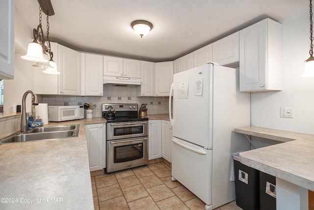 151 S Lake Dr, Lake Harmony, PA 18624 - kitchen featuring under cabinet range hood, white appliances, a sink, light countertops, and backsplash