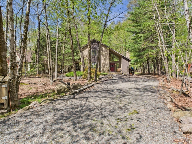 5541 Fox Rd, Pocono Pines, PA 18350 - view of front of house with a chimney and a wooded view