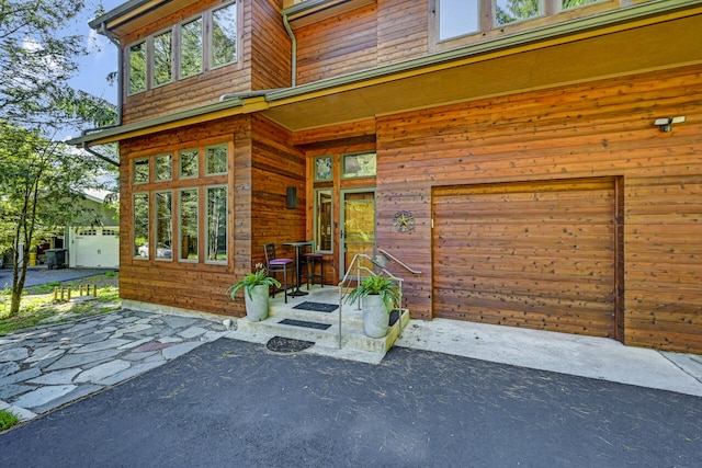 210 Egret Way E, Stroudsburg, PA 18302 - doorway to property with a garage