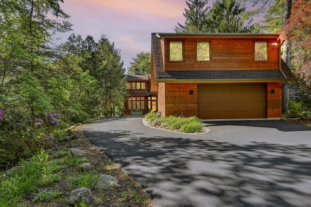 210 Egret Way E, Stroudsburg, PA 18302 - view of front facade featuring driveway, an attached garage, and a chimney