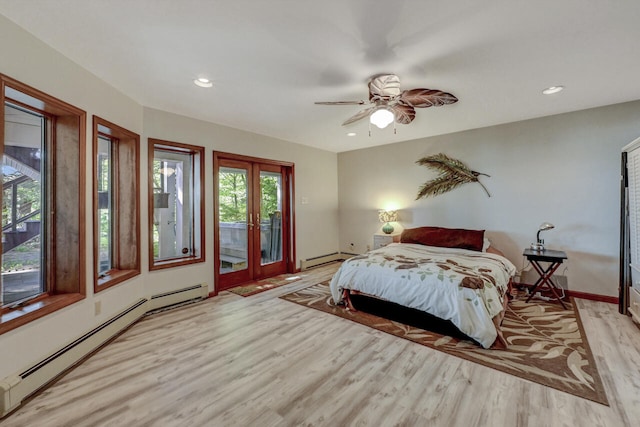 210 Egret Way E, Stroudsburg, PA 18302 - bedroom featuring light wood-style floors, access to outside, baseboard heating, french doors, and a baseboard heating unit