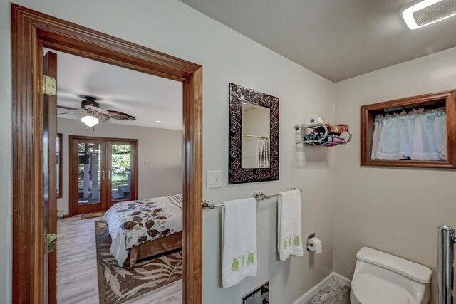 210 Egret Way E, Stroudsburg, PA 18302 - bathroom featuring toilet, wood finished floors, ceiling fan, and baseboards