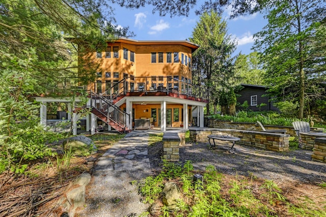 210 Egret Way E, Stroudsburg, PA 18302 - back of house featuring a fire pit, a wooden deck, stairs, and a patio area