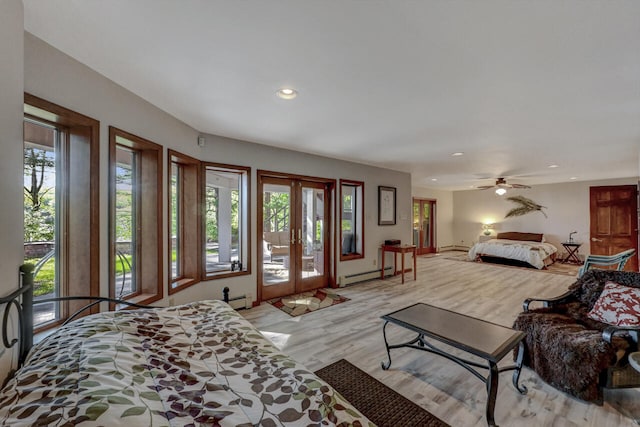 210 Egret Way E, Stroudsburg, PA 18302 - living room with a baseboard radiator, light wood finished floors, recessed lighting, french doors, and a ceiling fan