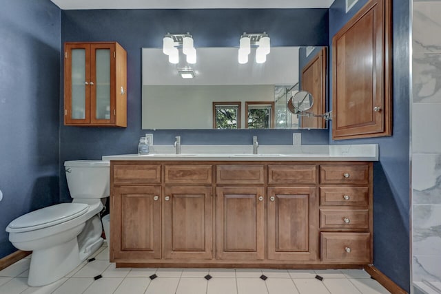 210 Egret Way E, Stroudsburg, PA 18302 - full bathroom featuring toilet, double vanity, baseboards, and a chandelier