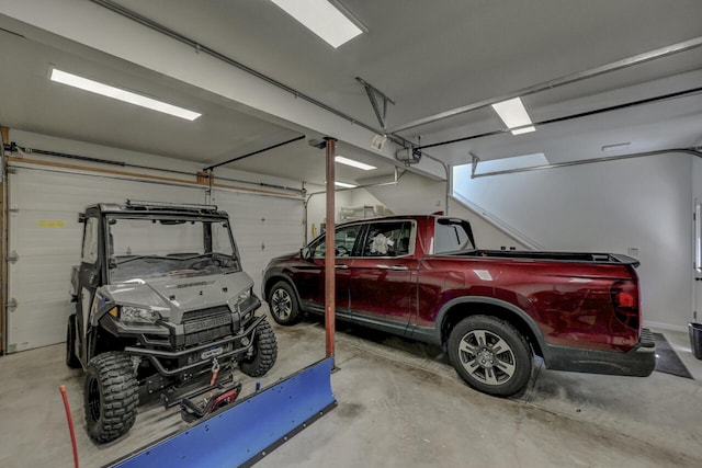 210 Egret Way E, Stroudsburg, PA 18302 - garage featuring a garage door opener