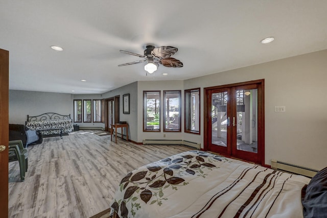 210 Egret Way E, Stroudsburg, PA 18302 - bedroom with a baseboard radiator, wood finished floors, access to exterior, french doors, and recessed lighting