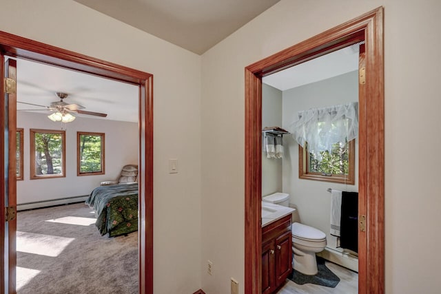 210 Egret Way E, Stroudsburg, PA 18302 - bathroom with a baseboard radiator, vanity, toilet, a ceiling fan, and ensuite bathroom