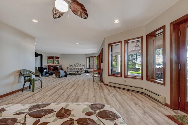 210 Egret Way E, Stroudsburg, PA 18302 - foyer entrance with light wood finished floors, recessed lighting, baseboards, a baseboard radiator, and a wood stove