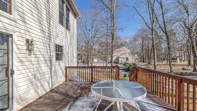 wooden terrace with outdoor dining area