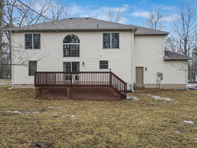 back of property with crawl space, roof with shingles, a lawn, and a wooden deck