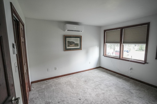 569 Lafayette Ave, Palmerton, PA 18071 - carpeted empty room with a wall mounted AC and baseboards
