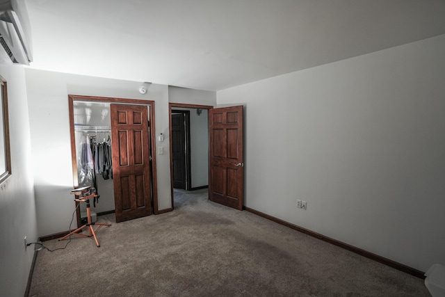 569 Lafayette Ave, Palmerton, PA 18071 - unfurnished bedroom with carpet flooring, a wall mounted AC, and a closet