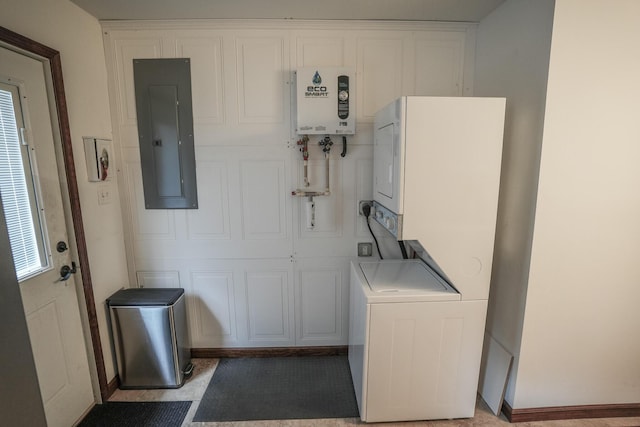 569 Lafayette Ave, Palmerton, PA 18071 - washroom with electric panel, cabinet space, water heater, and estacked washer and dryer
