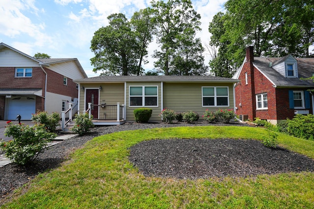 569 Lafayette Ave, Palmerton, PA 18071 - view of front of house with a front yard, a wooden deck, and an attached garage