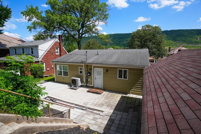 569 Lafayette Ave, Palmerton, PA 18071 - back of house with a patio area, roof with shingles, and a mountain view