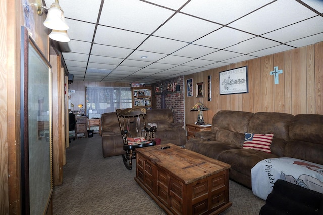 3193 Pine Ridge Dr, Bushkill, PA 18324 - living room with dark colored carpet, wood walls, and a paneled ceiling