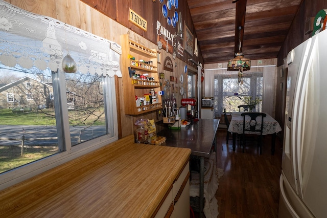 3193 Pine Ridge Dr, Bushkill, PA 18324 - dining space featuring wood walls, wood finished floors, vaulted ceiling with beams, and wooden ceiling