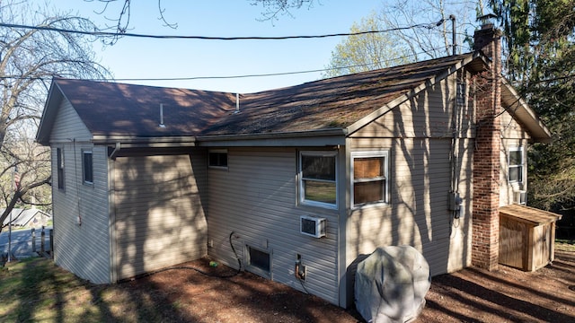 3193 Pine Ridge Dr, Bushkill, PA 18324 - view of home's exterior featuring roof with shingles and a chimney