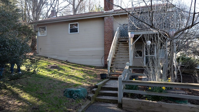 3193 Pine Ridge Dr, Bushkill, PA 18324 - view of home's exterior with a chimney and stairway