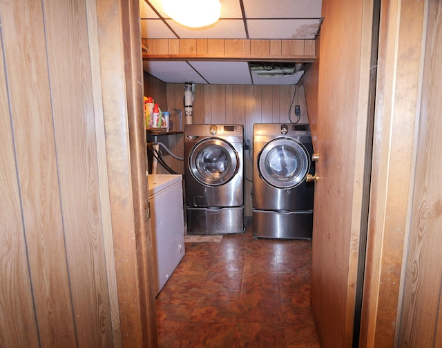 3193 Pine Ridge Dr, Bushkill, PA 18324 - washroom featuring tile patterned floors, wooden walls, washer and dryer, and laundry area
