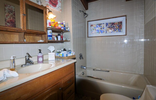 3193 Pine Ridge Dr, Bushkill, PA 18324 - full bath featuring tile walls, washtub / shower combination, vanity, and decorative backsplash