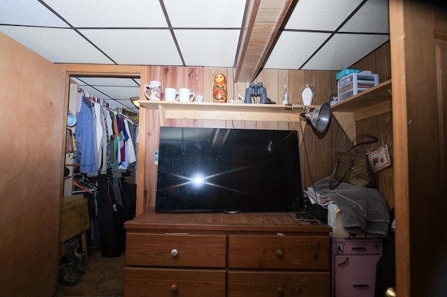 3193 Pine Ridge Dr, Bushkill, PA 18324 - bedroom with wood walls, a drop ceiling, and carpet floors